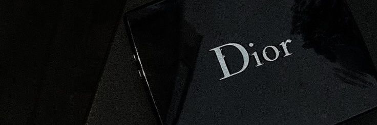 the dior logo is displayed on an umbrella