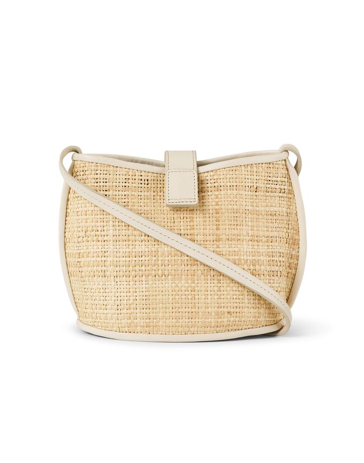 Bembien's Paola bag is the perfect bohemian-inspired carryall. Crafted from soft woven raffia, it's lined with an interior pocket and features a cream colored adjustable crossbody strap so you can wear it your way. Style this seasonless essential with your favorite casual looks for a chic finish. Vacation Woven Leather Pouch Shoulder Bag, Woven Leather Pouch Shoulder Bag For Vacation, Spring Shoulder Bag With Removable Pouch In Natural Color, Spring Natural Shoulder Bag With Removable Pouch, Beige Woven Leather Crossbody Straw Bag, Beige Woven Leather Crossbody Bucket Bag, Cream Crossbody Bucket Bag With Adjustable Strap, Natural Shoulder Bag With Braided Handles, Chic Cream Woven Bucket Bag