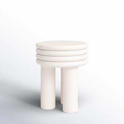 four white stools stacked on top of each other in front of a white background