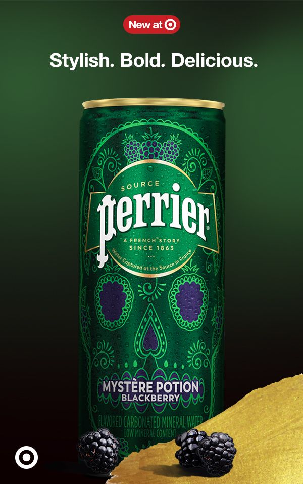 a can of perrier with blackberries next to it