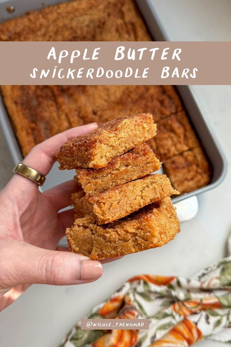 apple butter snickkerdoodle bars stacked on top of each other in front of a pan