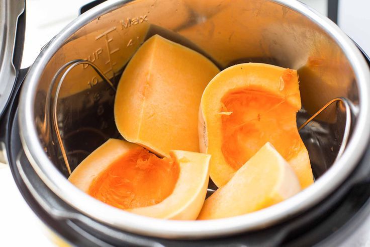 some kind of food that is inside of an electric pot on the stove top and ready to be cooked