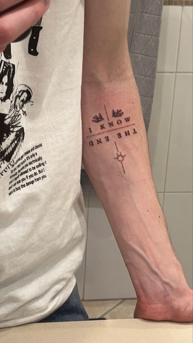 a person with a tattoo on their arm