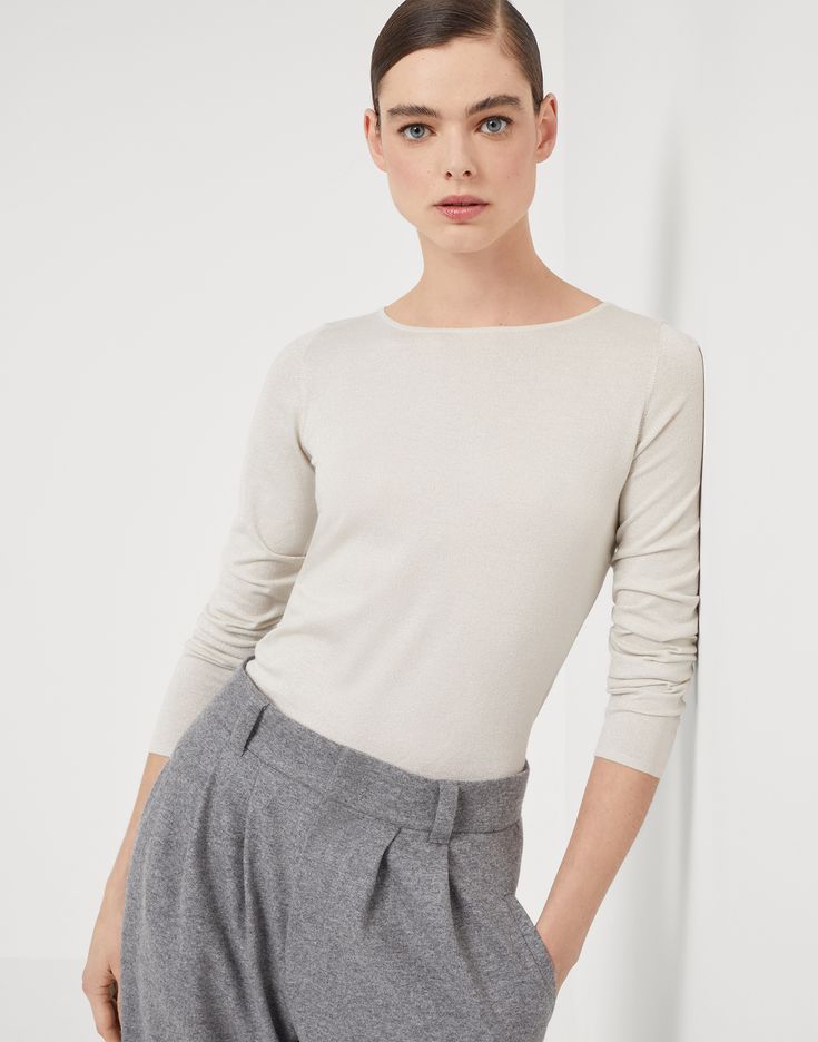 Cashmere and silk sparkling lightweight sweater Refined Brunello Cucinelli materials elevate the essential and feminine style of this new cashmere and silk sweater. The yarn’s lightweight and extremely soft texture pairs perfectly with the silhouette, characterized by fitted lines to the body in the bust and the shoulders. Elegant Fine Knit Top For Workwear, Elegant Fine Knit Top For Work, Elegant Beige Knit Top For Fall, Elegant Fine Knit Sweater For Fall, Elegant Spring Cashmere Top, Elegant Beige Knit Top For Work, Elegant Cream Knit Top For Work, Elegant Long Sleeve Knit Top, Elegant Fine Knit Tops For Layering