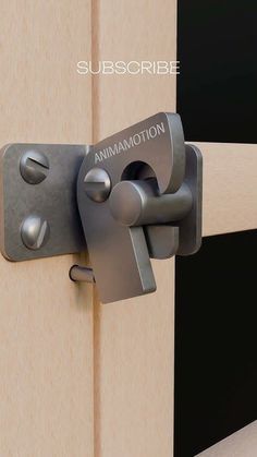 a close up of a door handle on a wooden door