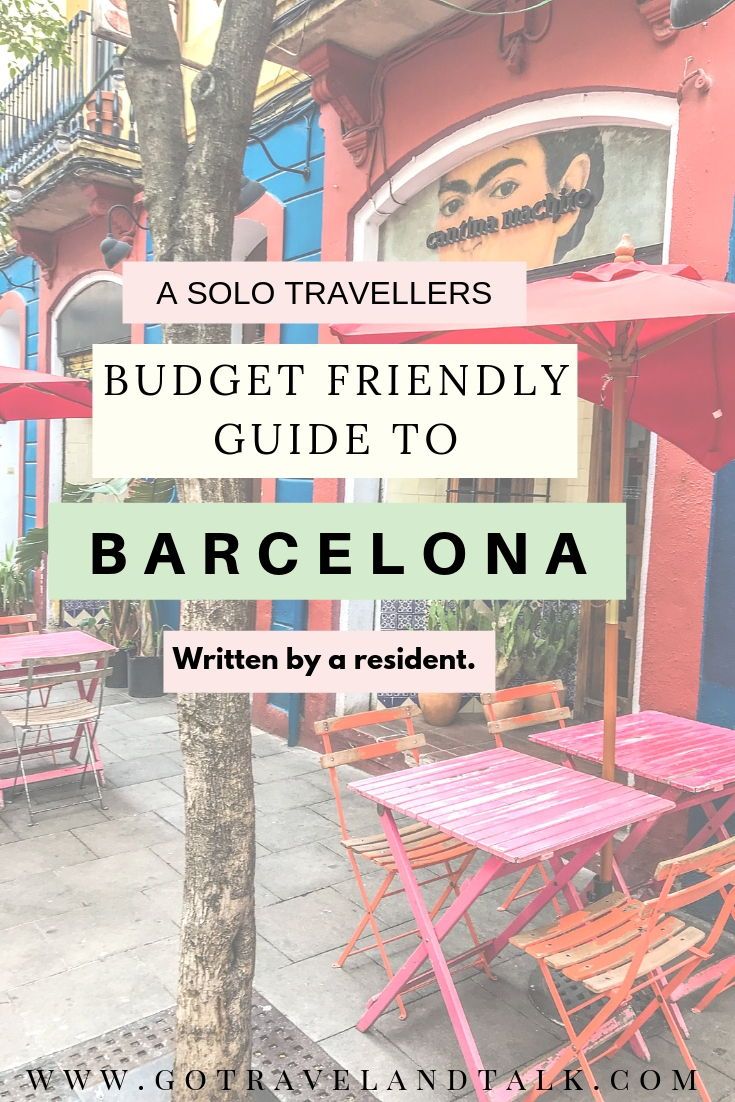 an outdoor patio with tables and umbrellas in front of colorful buildings, text reads a solo traveler's budget friendly guide to barcelona written by a resident