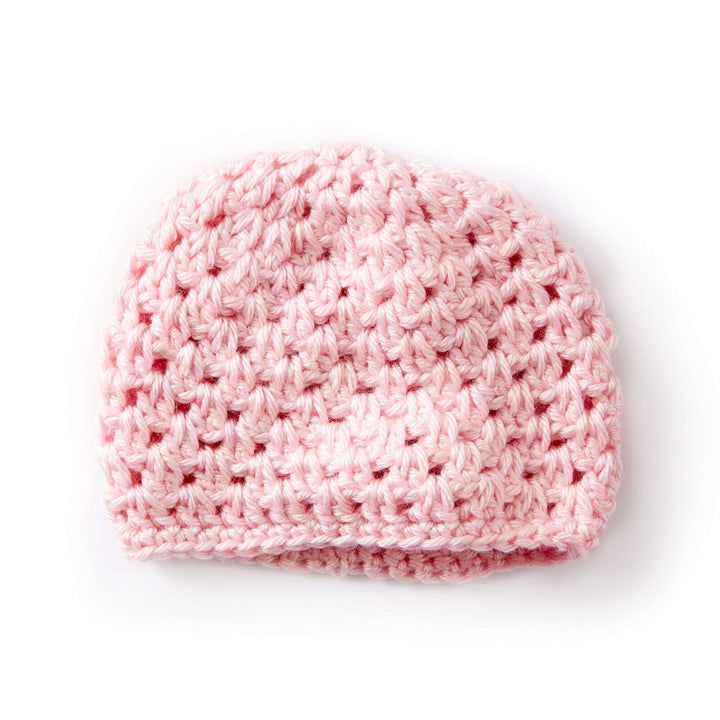 a pink crocheted hat on a white background