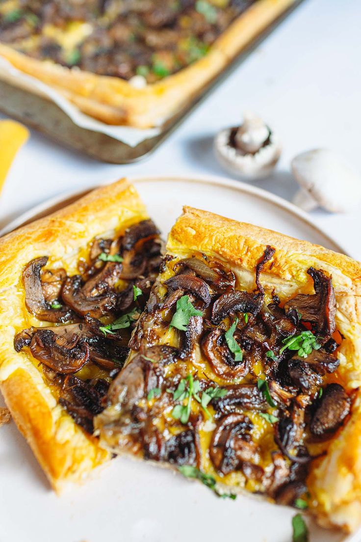 mushroom tart on a creamy plate and on a baking sheet, white mushrooms Vegan Savoury Tart, Vegan Pastry Savoury, Vegan Puff Pastry Dessert, Vegan Puff Pastry Recipes Savory, Mushroom Puff Pastry Recipes, Vegan Puff Pastry Recipes, Puff Pastry Vegetable Tart, Puff Pastry Vegan, Vegan Spring Recipes