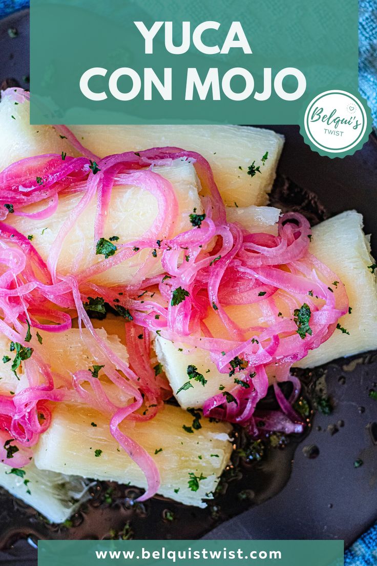 a black plate topped with sliced pineapples covered in red onions and green garnish