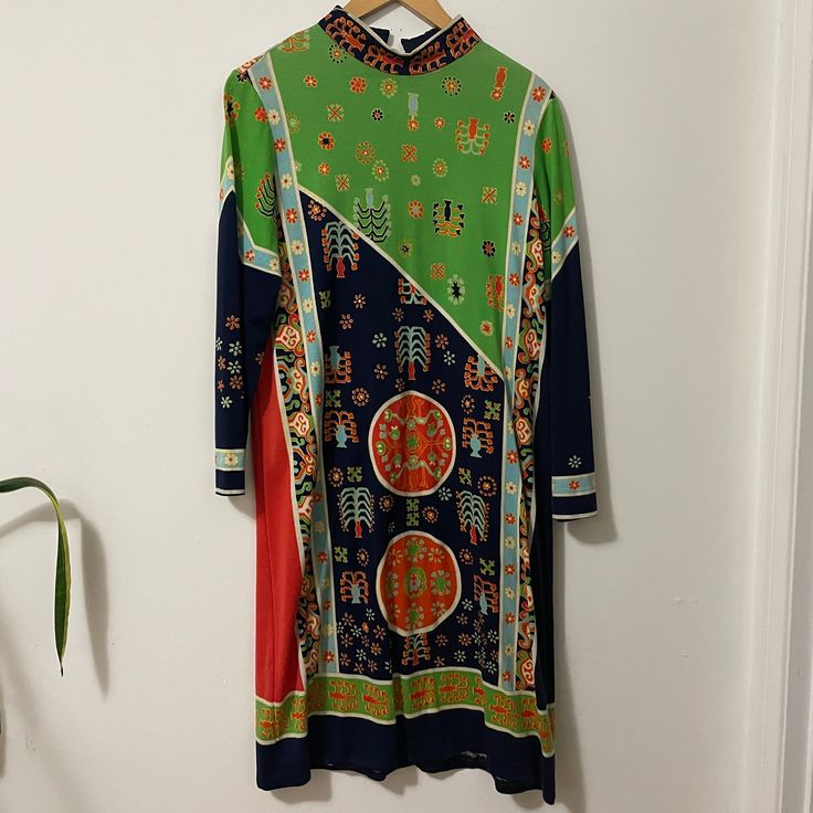 "Authentic 1960s Paganne knee length long sleeve dress with ultra rare Tree Off Life design in a beautiful bold color palette  Zipper back with hook and eye high neck closure  no fiber tags Measurements taken flat double when necessary Shoulder to shoulder 14\" Pit to pit 16\" Waist 14\" Pit to hem 35\" Due to the nature of vintage, all items in my store are sold as is. All sales are final without exception, I have a no returns/refunds policy. However, please contact me if there is a problem wit Patterned Long Sleeve Dress With Graphic Print, Long Sleeve Dresses With Abstract Print, Multicolor Long Sleeve Dress With Graphic Print, Retro Long Sleeve Dress With Vibrant Print, Multicolor Abstract Print Long Sleeve Dress, Long Sleeve Multicolor Abstract Print Dress, 70s Inspired Long Sleeve Dress With Retro Print, Multicolor Long Sleeve Dress With Vintage Print, Multicolor Long Sleeve Dresses With Vintage Print