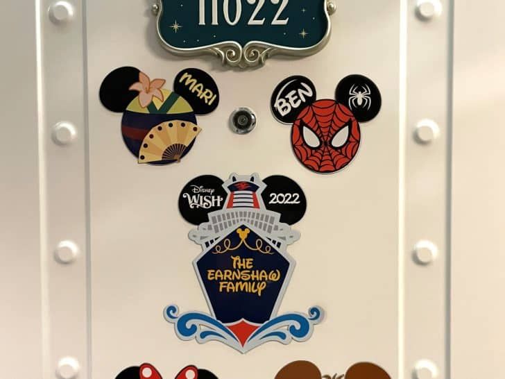 mickey mouse magnets are attached to the front of a refrigerator door that is decorated with disney characters