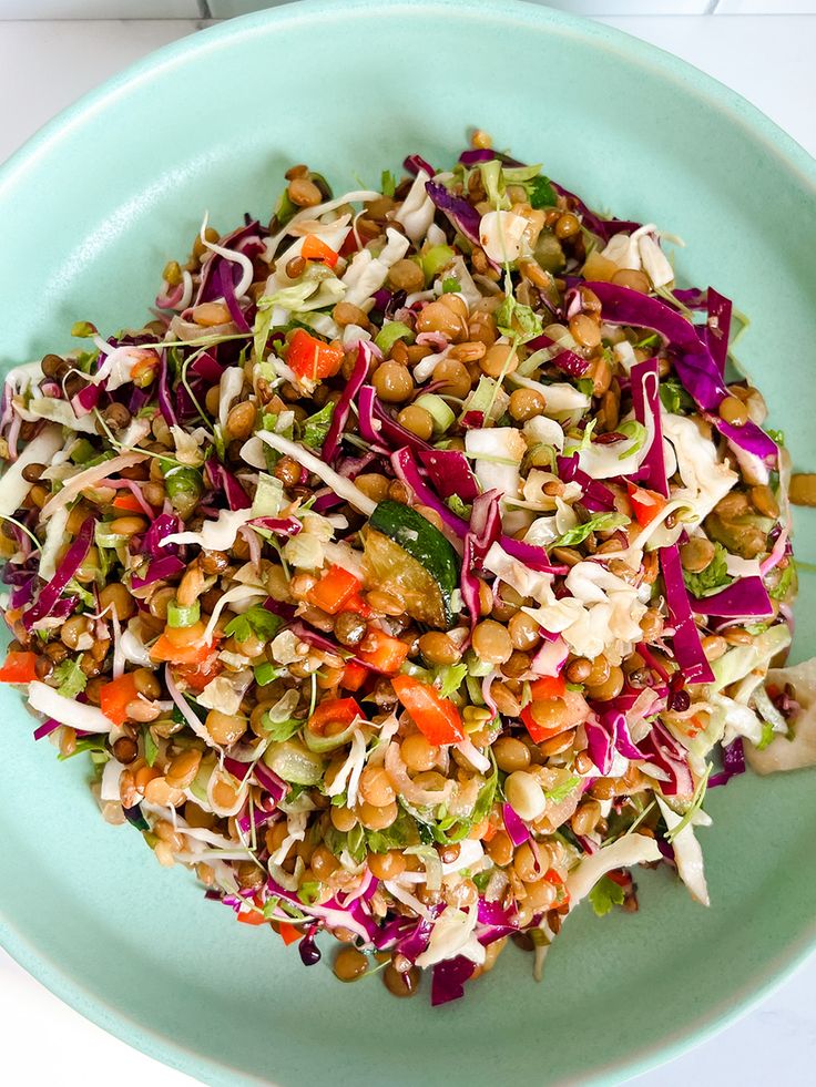 a green plate topped with lots of veggies