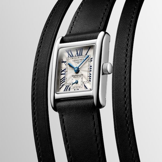 The Mini DolceVita is a masterpiece that exquisitely expresses Longines’ quiet luxury and contemporary elegance. 21.5 x 29mm rectangular stainless steel case Silver-tone "flinqué" dial with blue hands and painted Roman numerals Scratch-resistant sapphire crystal Swiss quartz movement Black leather strap with buckle clasp Water-resistant to 30 meters Caliber L178 Classic White Gold Everyday Luxury Watch, Elegant Rectangular Watch Accessories With Leather Strap, Modern Rectangular Dial Watch Accessories For Evening, Formal Silver Watch With Leather Strap, Elegant Black Watch Accessories With Rectangular Dial, Formal Silver Watch Accessories With Leather Strap, Classic Square Watch For Formal Occasions, Elegant Black Watch With Rectangular Dial, Luxury Formal Watch Accessories With Leather Strap