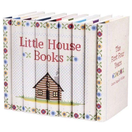 the little house books are lined up together