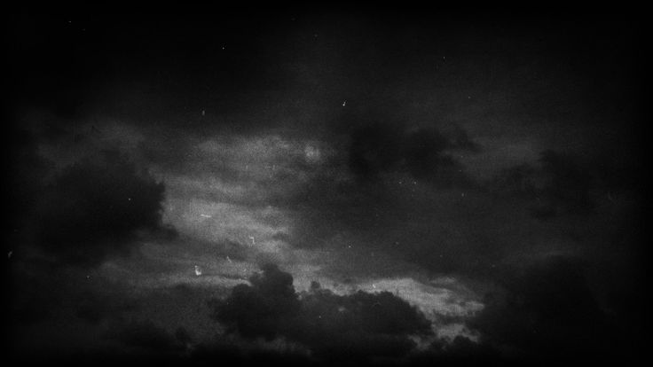 black and white photograph of dark clouds in the sky