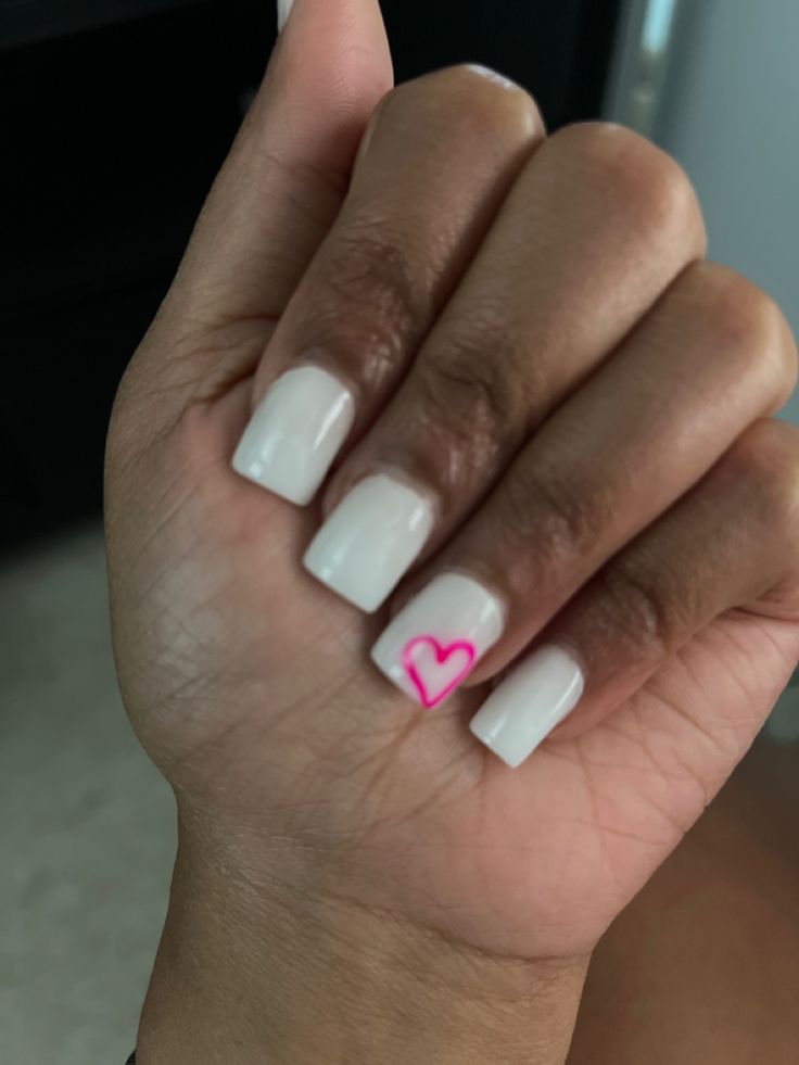 Acrylic nails Pink And White Nails Simple Design, Cute Nails With Ring Finger Design, White Acrylic Nails With Pink Heart, Nails Acrylic With Heart Design, White Nails With Designs Heart, Pink Nails With White Heart Design, Short White Nails With Pink Heart, White Nails With One Finger Design, Pink Nails With White Heart On Ring Finger