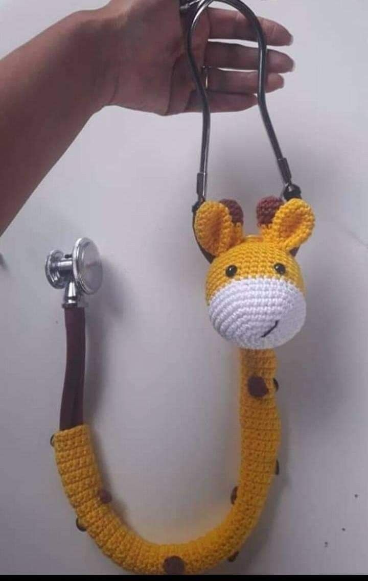 a crocheted giraffe with a stethoscope attached to it