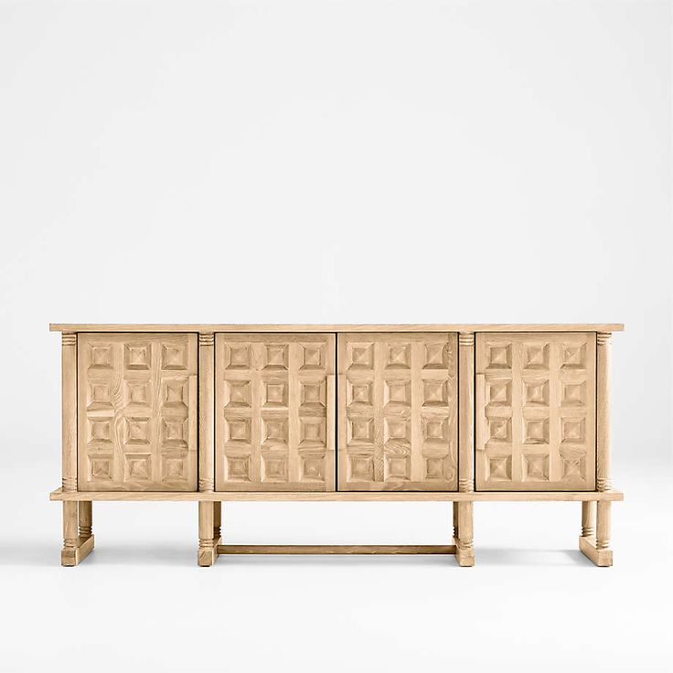 the sideboard is made out of wood and has an intricate design on it's sides