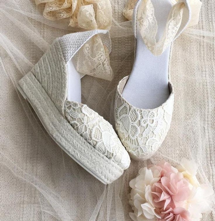 *Handcrafted Caroline luxe espadrilles in pretty lace for a sweet & romantic statement. *Made of delicate chantilly lace in pale ivory color *Unique Wedge heel made of natural jute traditionally handwoven in white color. *Rubber sole. .Lace Ribbon in ivory color matching the upper. *Heel measures : 4 inches ( 10 cm ) *Traditionally handmade in Spain. -SIZE: Contact us if you have any questions about sizes. Beige Summer Wedding Shoes With Round Toe, Spring Beach Wedding Shoes With Round Toe, Spring Wedding Shoes With Round Toe, Summer Wedding Shoes In Beige, Spring Wedding Shoes In Cream Lace, Cream Lace Wedding Shoes For Spring, Spring Beach Wedding Closed-toe Shoes, Spring Cream Lace Wedding Shoes, Beige Summer Wedding Shoes