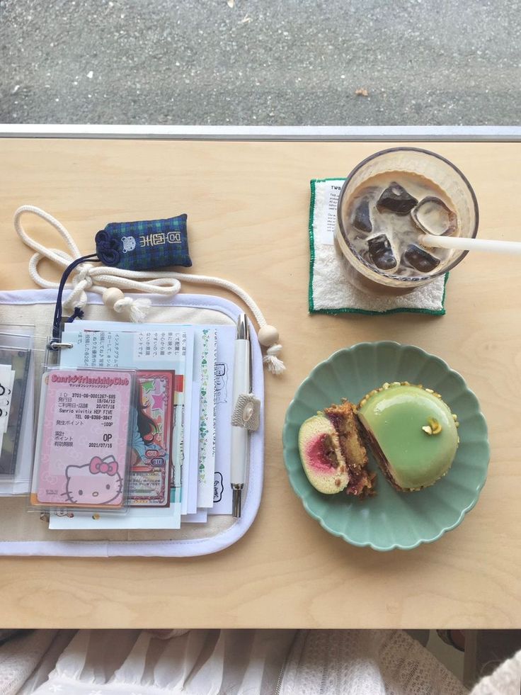 a table topped with two plates filled with desserts next to cups of coffee and drinks