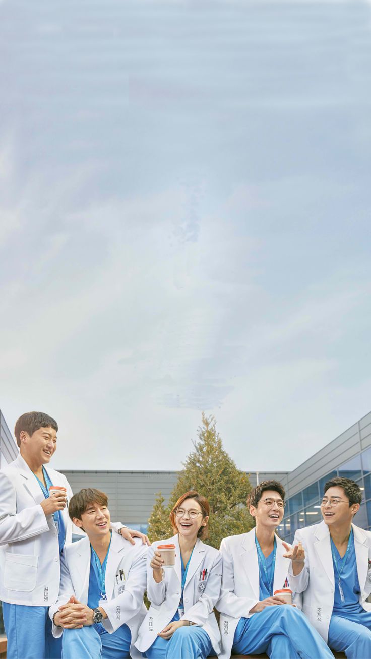 group of young men in blue and white suits posing for the camera