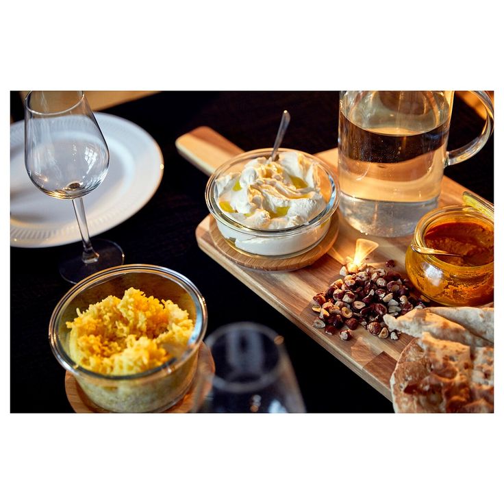 there are many different types of food on the trays, including bread and wine