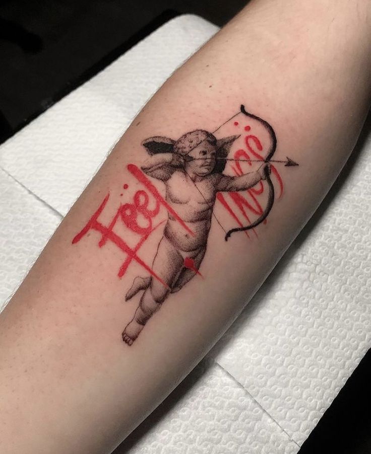 a tattoo on the arm of a person with an arrow