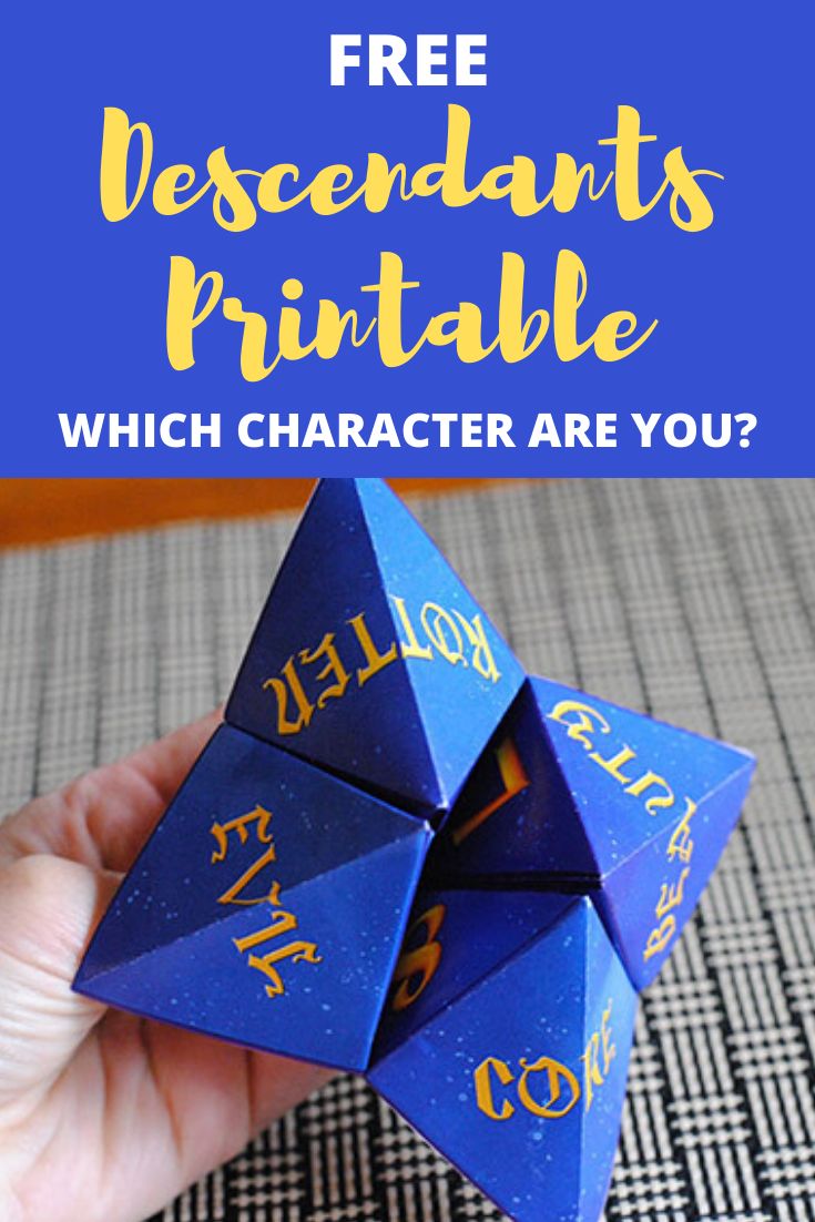 a hand holding a blue origami dice with the text free printable which character are you?