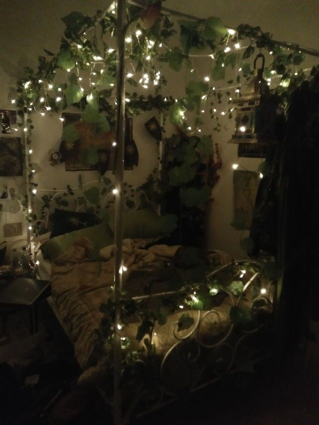 a bed with lots of lights on it in a room