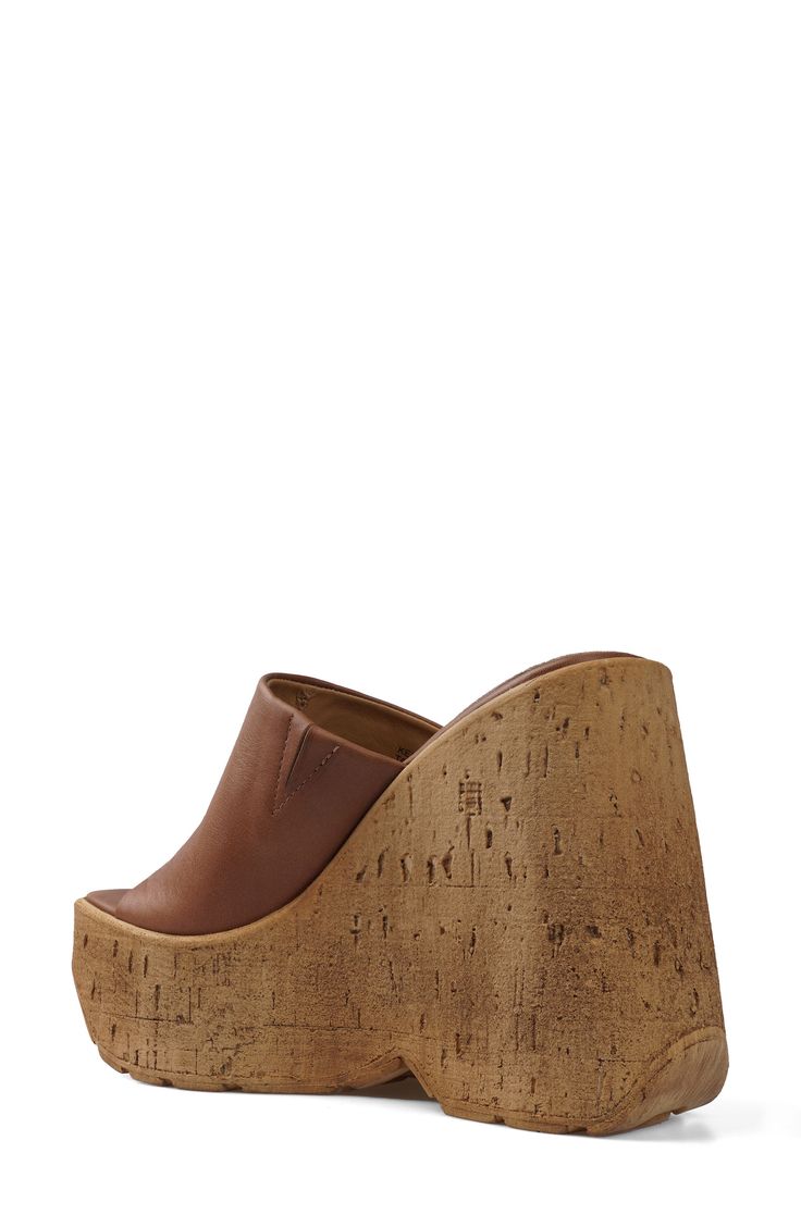 A cork-textured wedge heel adds textural edge to an old-school sandal topped with a smooth leather strap. 5" heel; 2" platform Leather upper and lining/synthetic sole Imported Platform Cork Wedge Sandals For The Beach, Brown Cork Wedge Sandals For Summer, Summer Brown Cork Wedge Sandals, Cork Wedge Heels With Platform, Cork Platform Open Toe Heels, Cork Platform Heels With Open Toe, Brown Platform Wedge Sandals In Synthetic Material, Brown Platform Wedge Sandals In Synthetic, Brown Synthetic Platform Wedge Sandals