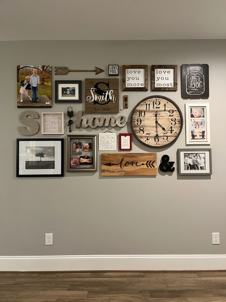 a wall with many different pictures on it and a large clock mounted to the wall