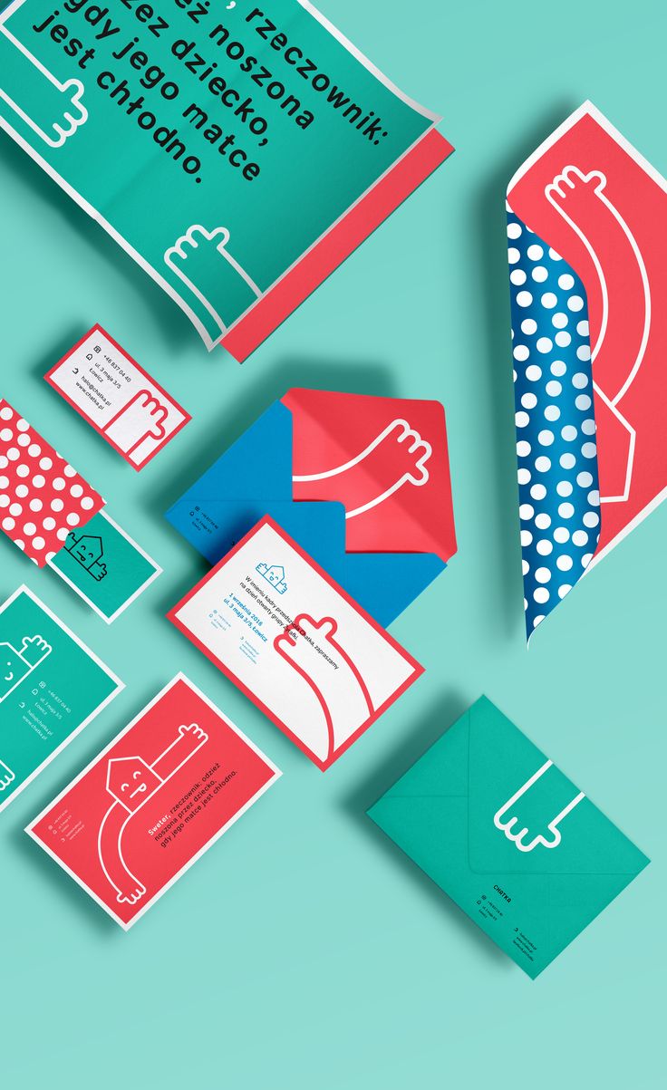 various business cards and envelopes on a blue background with red, white, and green designs