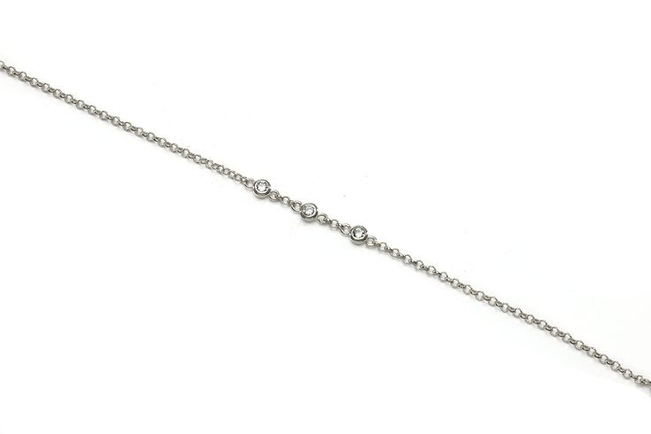 Adorn your wrist with this minimalist bracelet, artfully crafted with a 14k gold chain and adorned with three sparkling cubic zirconia stones. This dainty, delicate piece is the perfect accessory for everyday wear, offering a touch of elegance and sophistication to any outfit. It would make a perfect gift for mom, or a special treat for yourself. Cherish this high-quality, durable bracelet that is sure to become a favorite in your jewelry collection. Three cubic zirconia stones Minimalist 14k gold chain bracelet Dainty and delicate design Elegant and sophisticated accessory Beautiful addition to any jewelry collection Product specifications Jewelry Information Metal stamp 14K Metal Gold Filled Gem Type Cubic Zirconia Setting Bezel Resizable No Stone Information Stone shape Round Shape Mini