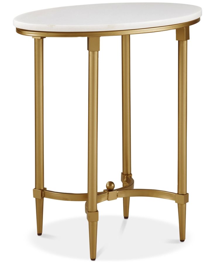 a white table with gold legs and a round top