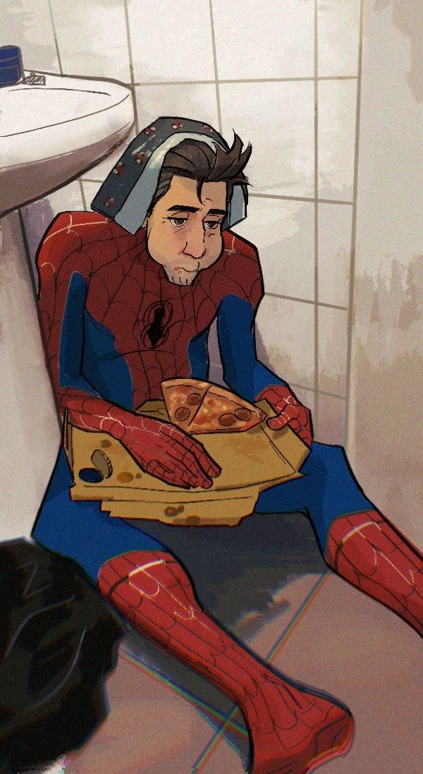 a man sitting on the floor in front of a toilet holding a box of pizza