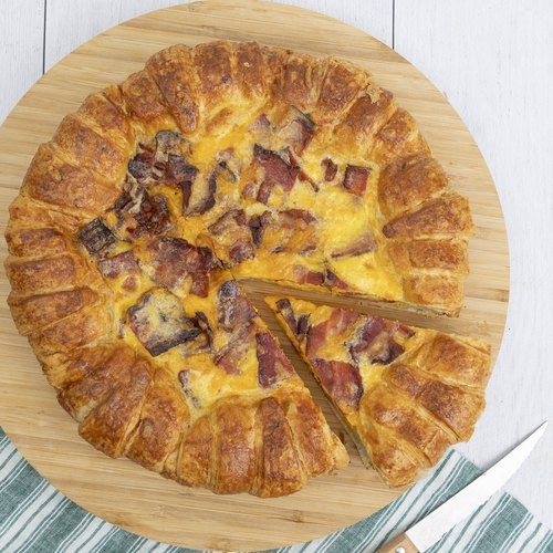 a wooden cutting board with a pizza on it