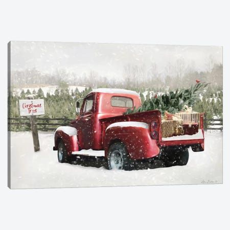 an old red truck with a christmas tree in the back