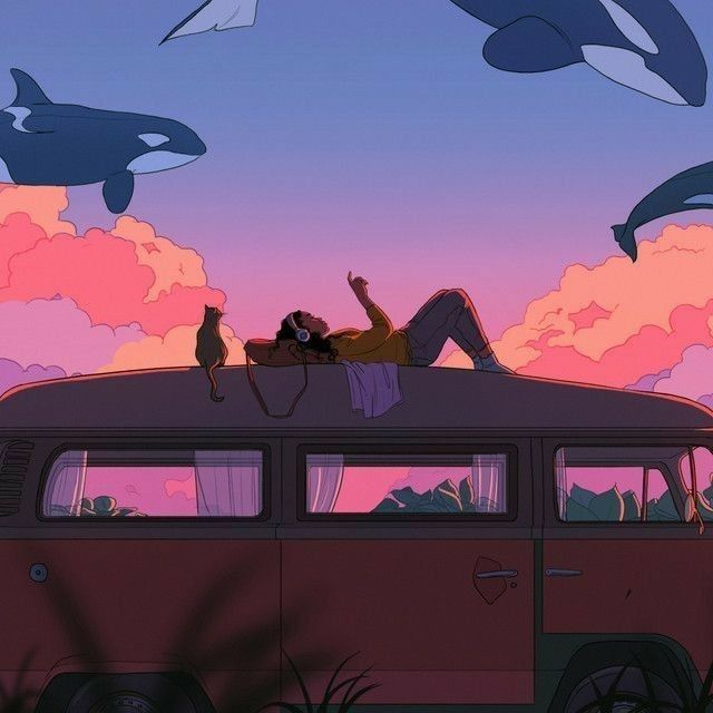 a woman laying on top of an old van in front of some orca whales