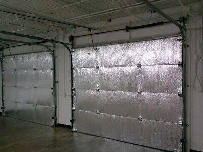 an empty garage with two doors closed and no one in the room or on the floor