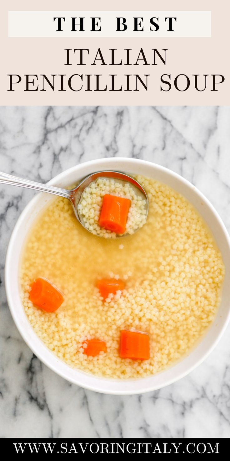 a bowl of soup with carrots and couscous in it on a marble counter top