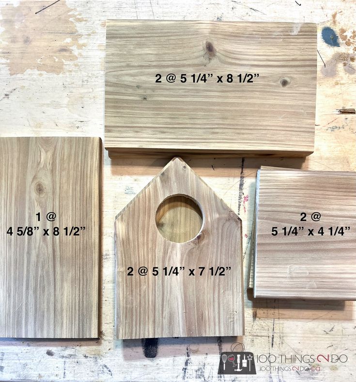 some wood pieces are laying on top of each other and measuring for the holes in them