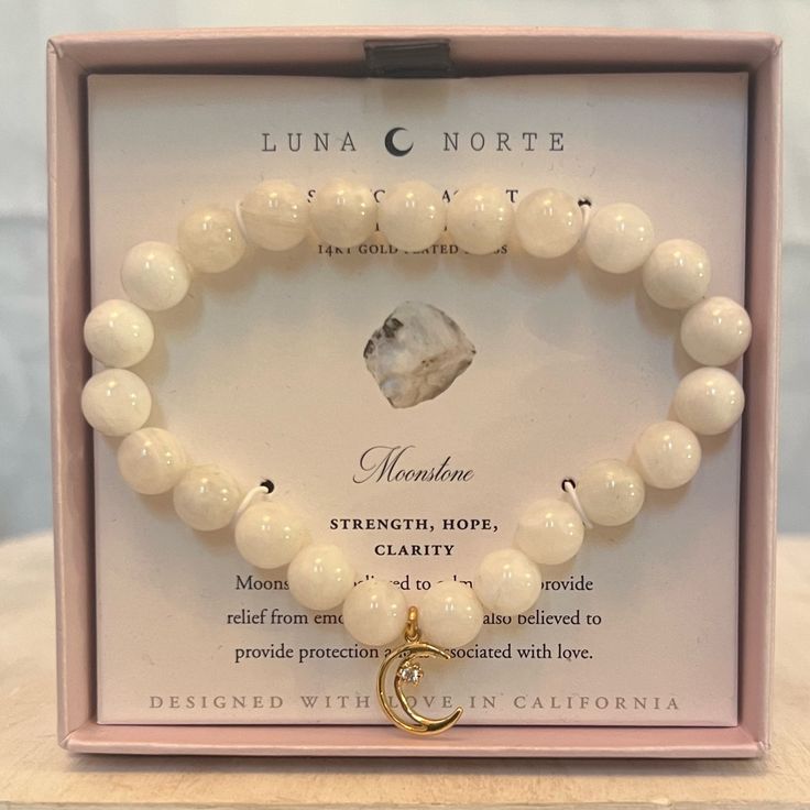 Brand New Item With Box Luna Norte Moonstone Stretch Bracelet -14k Gold Plated Brass -One Size Fits Most -Moonstone -Strength, Hope, Clarity -Moonstone Is Believed To Calm And To Provide Relief From Emotional Stress. It Is Also Believed To Provide Protection And Is Associated With Love. -Color: Gold/White -Weight: 1.8oz (Before Any Packaging) Please Ask Any Questions. All Sales Are Final. Thank You For Checking Out My Listing! Pineapple Bracelet, Seashell Bracelet, Silver Handbag, Floral Cuff, Black Gold Chain, Yellow Quartz, Rhinestone Crown, Purple Pearl, White Bracelets