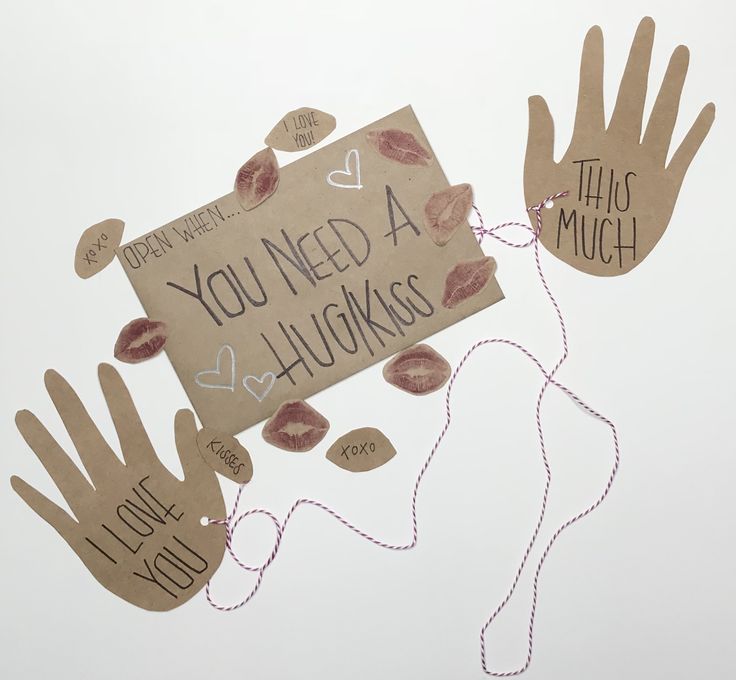 handprints with words on them that say you need a hug and two hands holding a sign