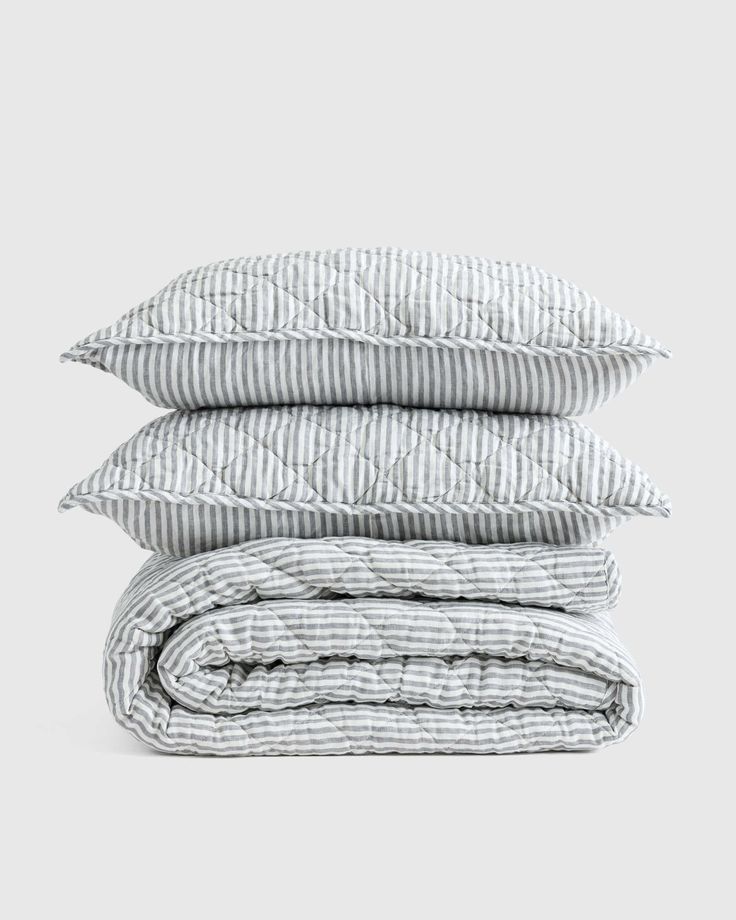 three pillows stacked on top of each other