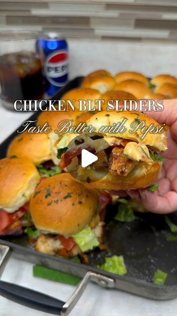 a person holding a sandwich in their hand with the words chicken blt sliders on it