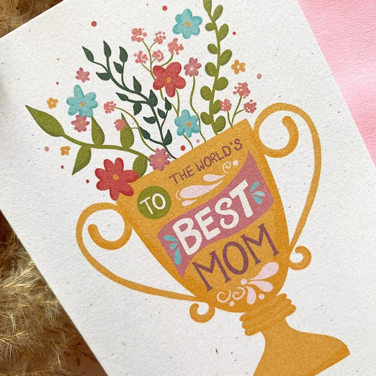 a card with the words to the world's best mom and flowers in it