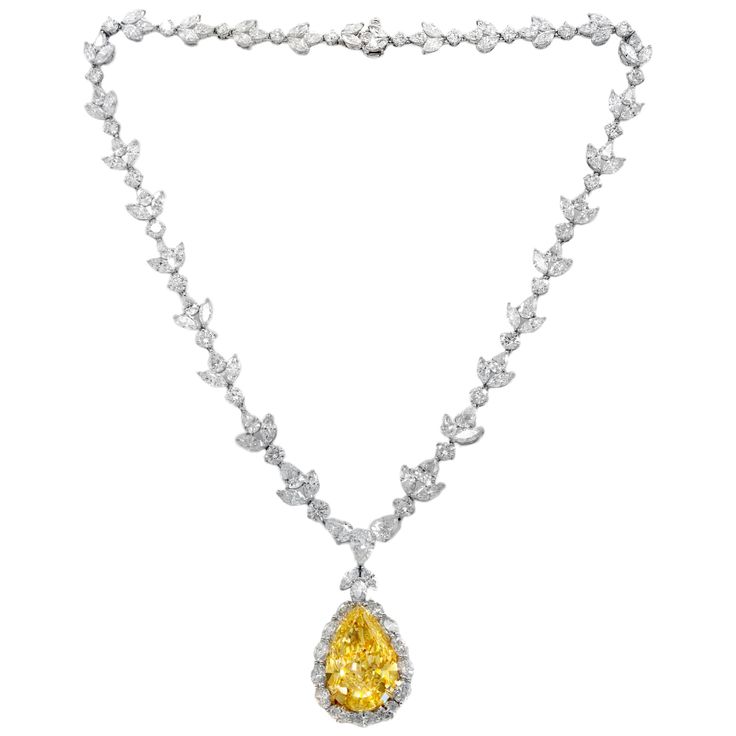 Platinum diamond necklace with GIA certified center 35.31 fancy intense vivd yellow vs2 pear shape, GIA#2145952743 set in platinum handmade necklace, features 47.00ct of outside diamonds D/E/F VVS-VS quality. Plus center 1.50ct pear e vs1 GIA#24155411814 Yellow Diamond Jewelry, Most Expensive Jewelry, Expensive Necklaces, Yellow Diamond Necklace, 4 Necklace, Haute Jewelry, Drop Necklaces, Diamond Pendant Sets, Yellow Diamonds