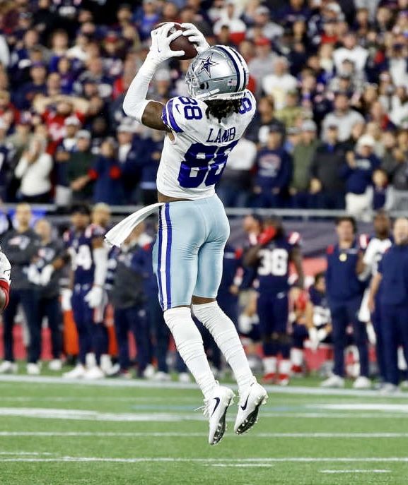 a football player jumping up in the air