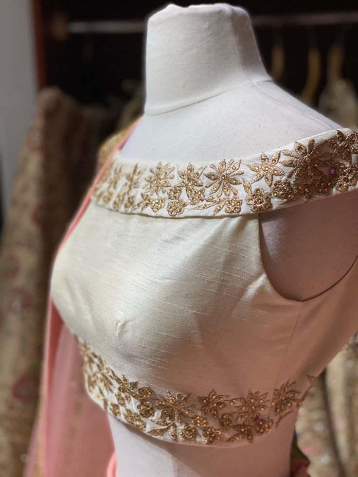 Dusky peach heavy kundan border lehenga with contrasting pearl white floral zardozi embroidery off shoulder blouse and net border dupatta. Fabric: Raw Silk This outfit can be customized in multiple colors and specific to client measurements. 90 days of production time is required and are for bulk orders only! Orders are processed in store only! Final fittings/alterations not included. Minimum Order Quantity- 4 pieces Traditional Drape Raw Silk Lehenga With Pearl Embroidery, Designer Raw Silk Lehenga With Pearl Embroidery, Peach Resham Embroidery Blouse Piece For Wedding, Peach Unstitched Blouse For Wedding, Wedding Blouse Piece With Pallu In Peach, Peach Blouse Piece With Pallu For Wedding, Peach Traditional Wear With Unstitched Blouse For Wedding, Peach Pre-draped Saree For Wedding, Peach Traditional Drape Blouse For Wedding