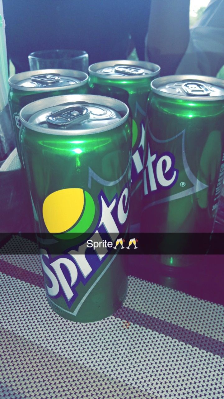 six cans of sprite soda sitting on top of a table